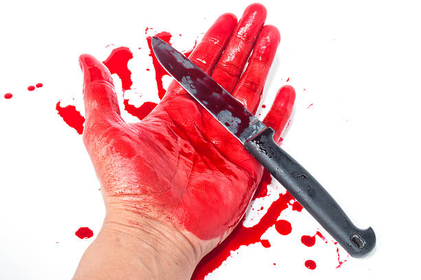 istock Dead hand with blood and knife 481999630