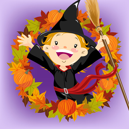 Little girl dress up witch costume stand inside the autumn leaf wearth.