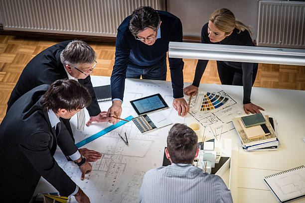 Architect explaining project plan to clients Architects and customer in the office. architectural model photos stock pictures, royalty-free photos & images