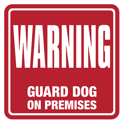 Red sign or label with the text, Warning, Guard Dog on Premises. Sign would be used on doors, windows or premises to deter theft, trespassing or illegal activity. Label is square with a bright red background with bold, white lettering. Sign is embossed with soft highlight shadow to create a three-dimensional look.