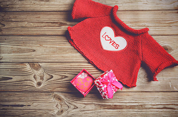 istock cute red sweater and gift box with a heart 482011156