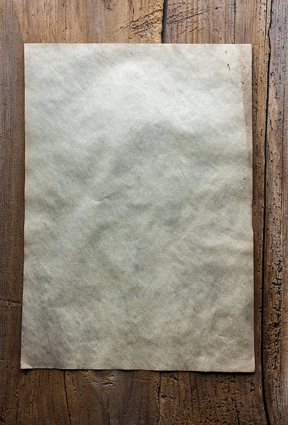 istock paper on wooden background 482012673