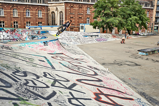 Brussels, Belgium - July 18, 2015: BMX Biker in action at the skate park in central Brussels.The Ursulines square is a public open square in skateboarding, BMX, inline skating, etc.