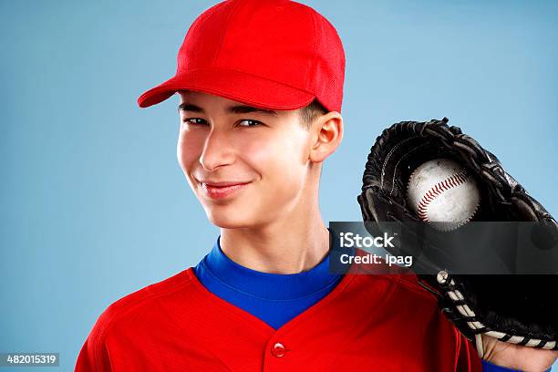 Portrait Of A Teen Baseball Player In Red Uniform Stock Photo - Download Image Now - Activity, Base - Sports Equipment, Baseball - Sport