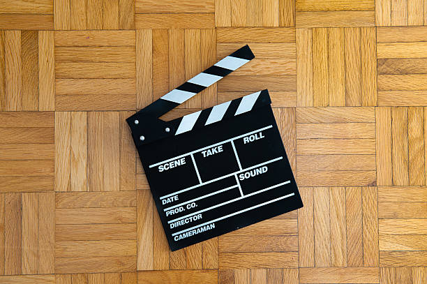 istock Movie clapper board on wooden floor 482018674