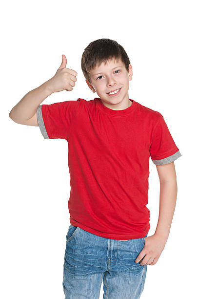 istock Young boy in the red shirt holds his thumb up 482026035