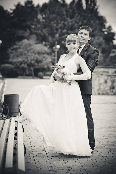 istock bride and groom in the park, a wedding bouquet, 482027177