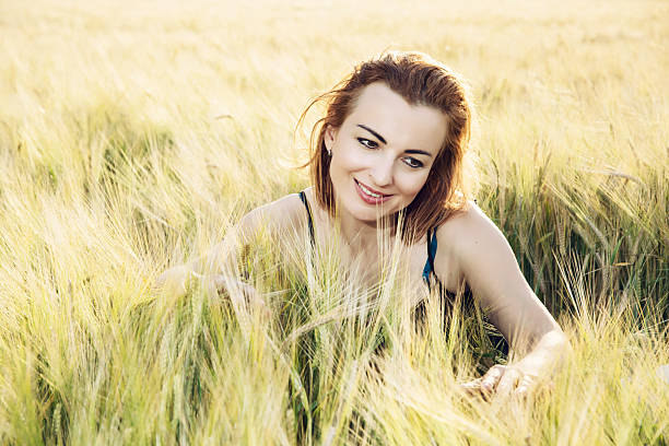 istock Woman in love is smoothing the wheat cobs 482027764