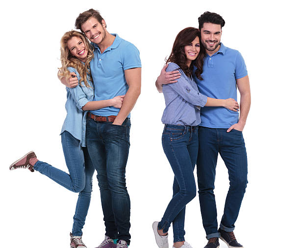 istock two happy couples of young casual people standing embraced 482027821