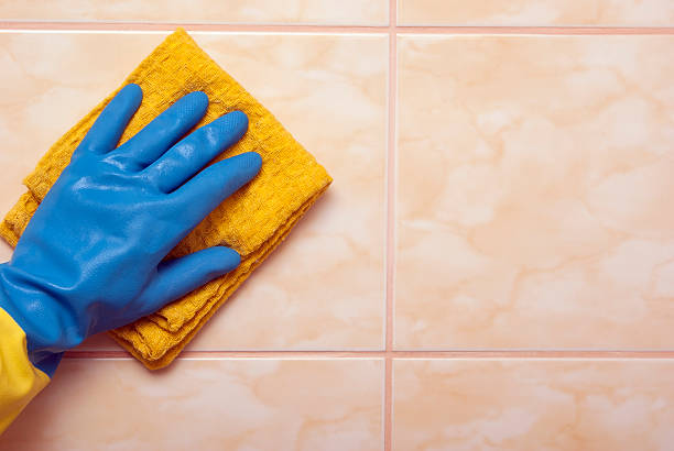 istock Hand in blue with yellow glove 482029264