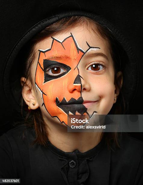 Pretty Girl With Face Painting Of A Pumpkin Stock Photo - Download Image Now - Art, Art And Craft, Autumn