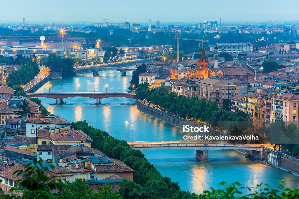 River Adige and bridges in Verona at night, Italy Verona skyline with river Adige and bridges at night, view from Piazzale Castel San Pietro, Italy 2015 Stock Photo