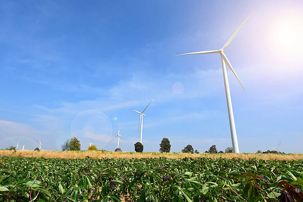 istock wind turbine against cloudy blue sky background 482038980