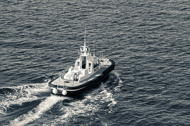 istock Small pilot boat is underway on a sea water 482039912