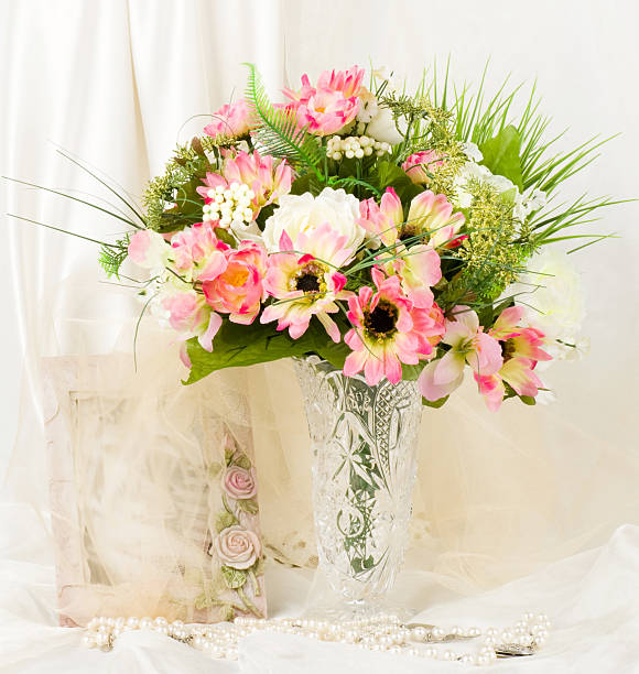 istock Beautiful spring flowers in a glass vase and frame 482042441