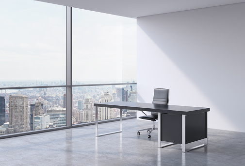 A workplace in a modern panoramic office, New York city view from the windows. A concept of financial consulting services. 3D rendering.