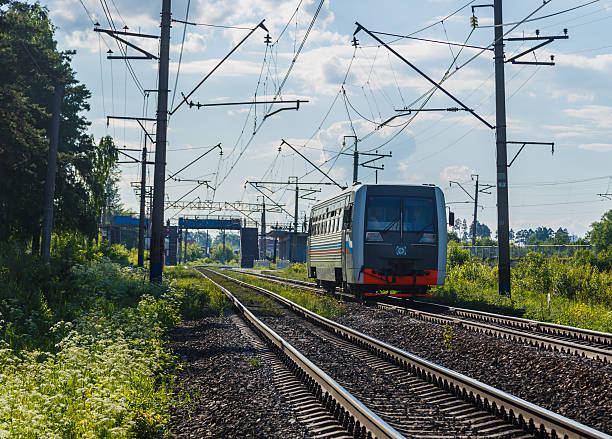 istock Electric train goes by rail, summer, countryside 482044202