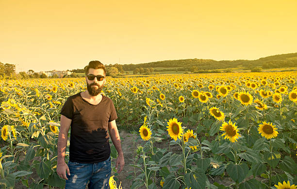 istock Young Man in Sunflower Field 482045016