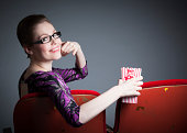 attraktive-frau-im-theater-isoliert-auf-grauem-hintergrund.jpg?b=1&s=170x170&k=20&c=NvwolrVCWq43KSZ5G0nOcG37m8L9cp6XyKqnpEHSXmw=