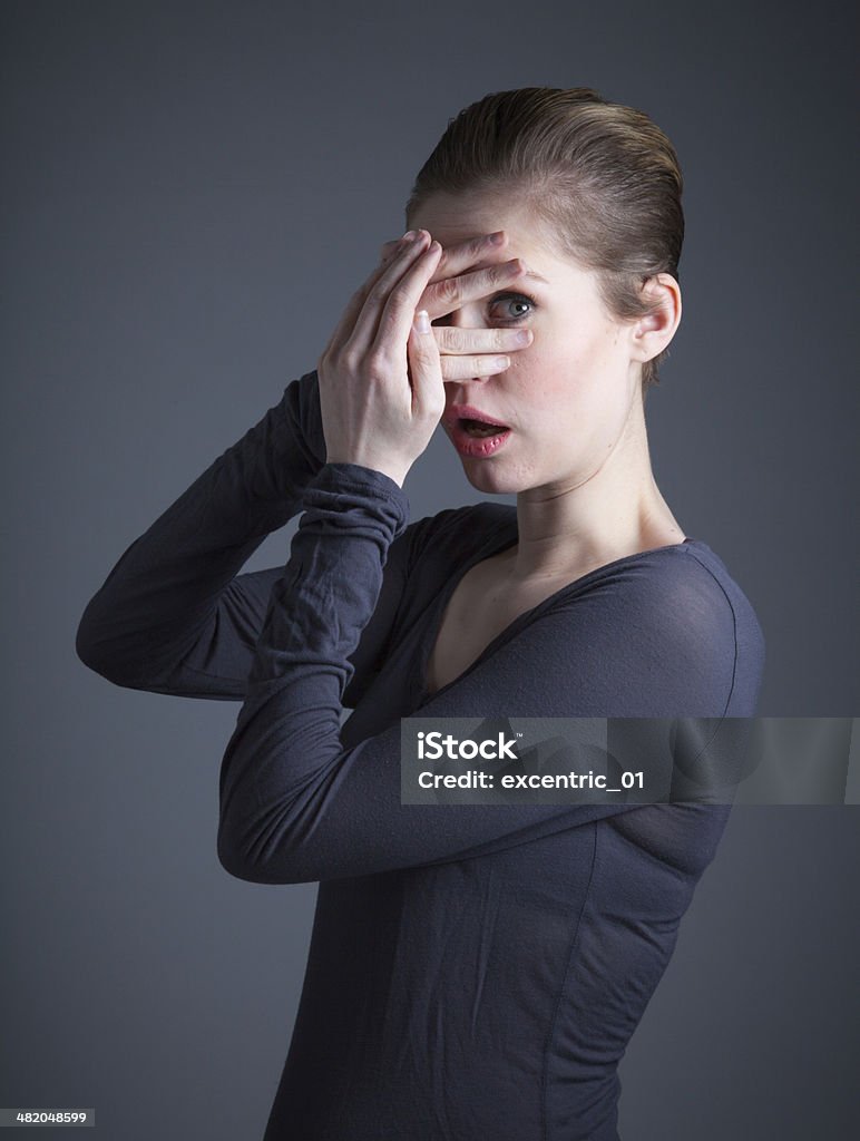 Attractive woman isolated on grey background 20-29 Years Stock Photo