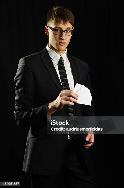 Caucasian Man Holding Few White Business Cards Stock Photo - Download Image Now - Adult, Adults Only, Advice