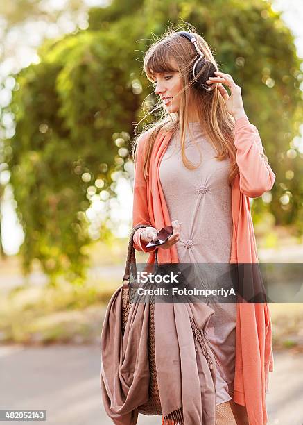 Young Beautiful Girl Listening To Mp3 Player Stock Photo - Download Image Now - Adult, Arts Culture and Entertainment, Asia