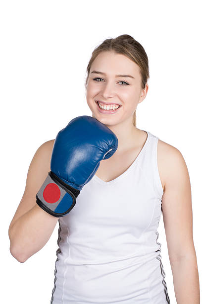 istock Woman holds boxing glove under her chin 482058873