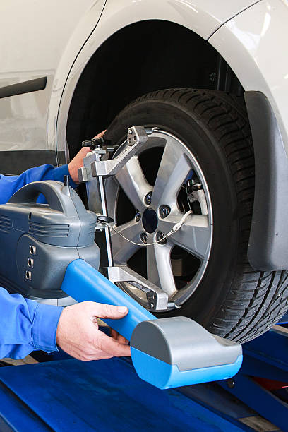 istock Fragment of car tyre during diagnostic testing and adjusting  to 482059921