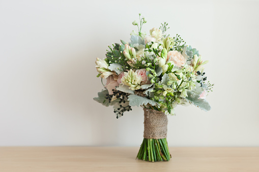 bride's bouquet, wedding bouquet, bouquet of fresh flowers, stands on the table, flower arrangement in the shape of a ball, wedding Floristics