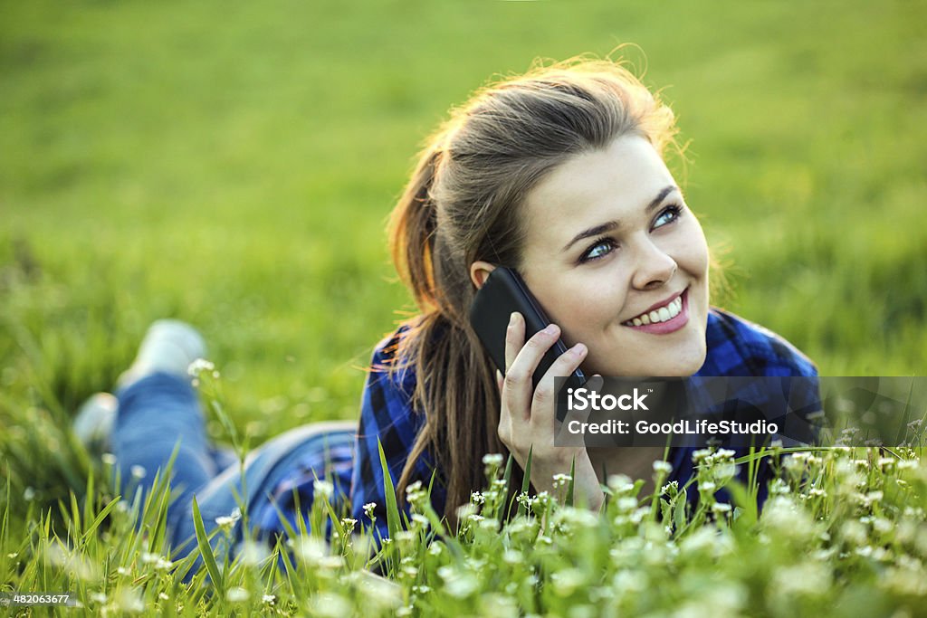 On the phone Young beautiful woman enjoying talking on the phone 20-24 Years Stock Photo