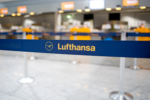 Frankfurt Airport, Germany - March 19, 2011: Barrier tape of Lufthansa in front of check-in counters in order to keep the passengers at the baggage drop off in queue. Lufthansa is the largest airline in Europe and the world's fifth-largest airline and part of the intercontinental airline network Star Alliance.