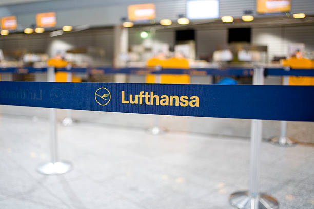 Lufthansa barrier tape in front of check-in counters stock photo