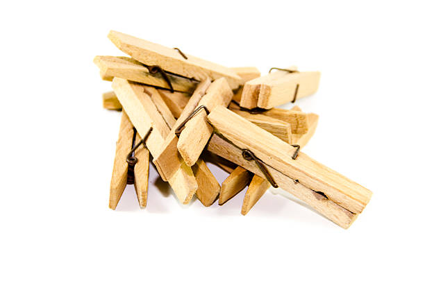 istock Wooden Clothespins on white background 482066353