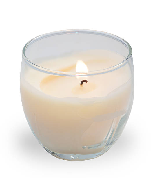 istock White candle burning in transparent glass 482067759