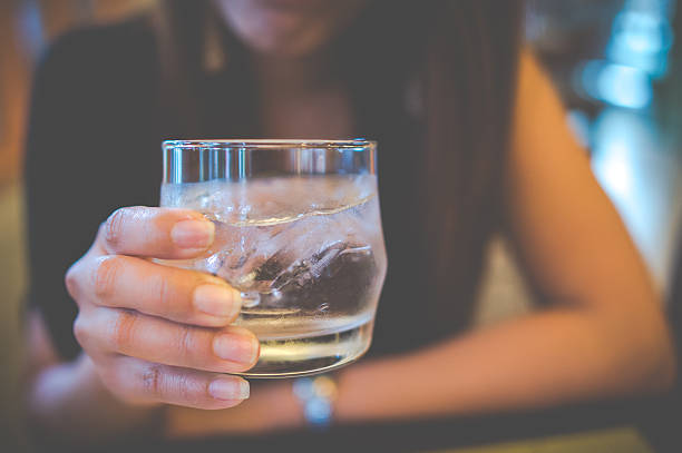 istock girl holding water glass 482068422