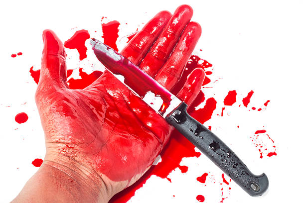 istock Dead hand with blood and knife 482068504