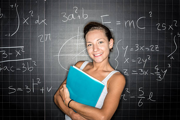 istock School education portraits: student genius in front of blackboard 482070786