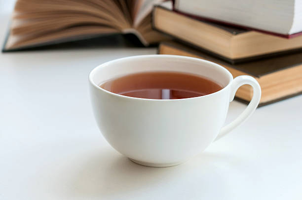 istock Cup of black tea and some books the table 482072654
