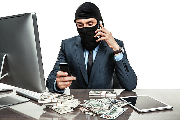 maskowane anonimowe biznesmen sobie kask kominiarka - extortionist zdjęcia i obrazy z banku zdjęć