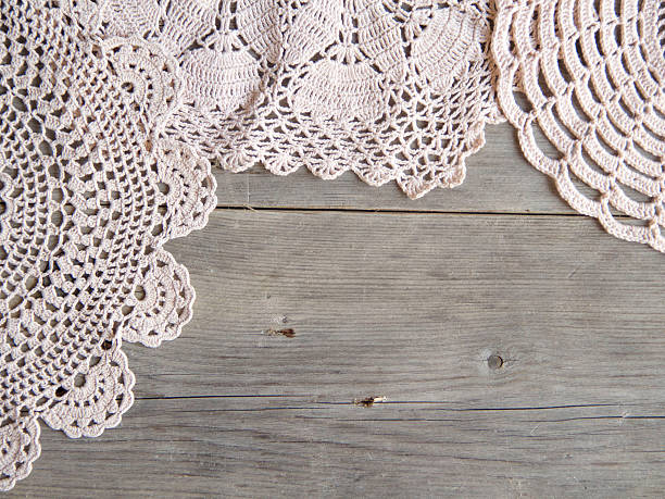 istock Crochet doilies over old grey wood 482077103