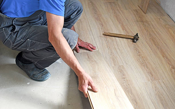 istock male carpenter puts the laminate 482077186
