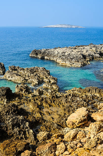 istock Rocky coast in Istria with a small island 482077432
