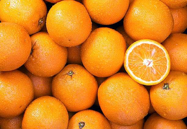 orange background - orange frucht stock-fotos und bilder