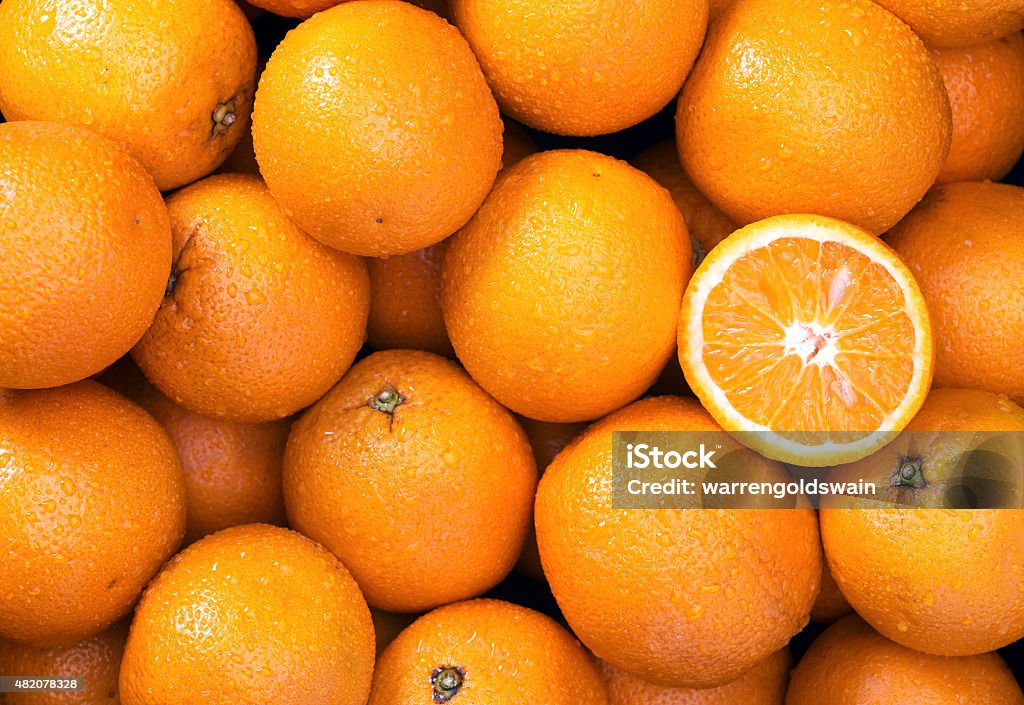 Orange background Oranges Raw fruit and vegetable backgrounds overhead perspective, part of a set collection of healthy organic fresh produce Orange - Fruit Stock Photo