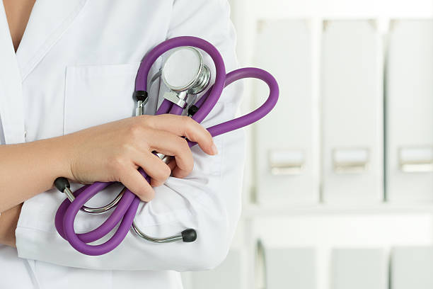 Female doctors's hands holding stethoscope