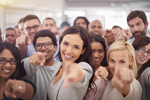 Portrait of a group of smiling businesspeople pointing at the camerahttp://195.154.178.81/DATA/i_collage/pi/shoots/783159.jpg