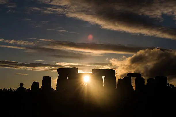 This is a sunset at stonehenge the night of the summer solstice