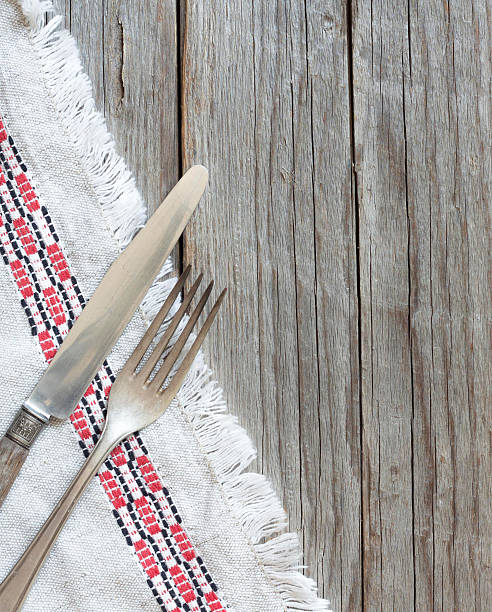 istock Vintage fork and knife on napkin on old wood 482080008