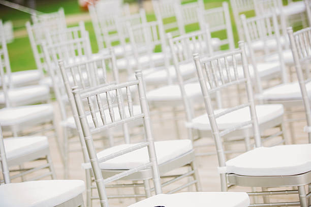 istock Prior to a wedding ceremony, endless white chairs 482080092