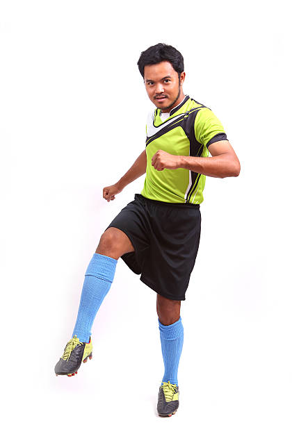 istock Young soccer football player on white 482081873